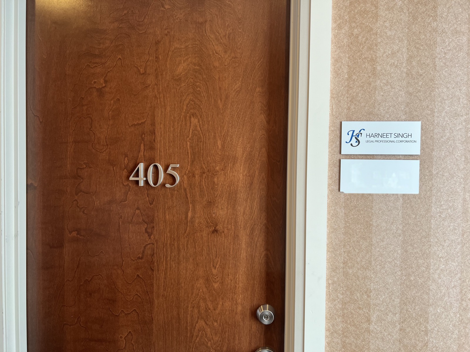 Office entrance for HS Legal PC, suite 405.